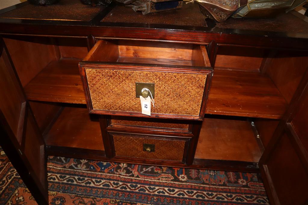 An Indian hardwood and rattan sideboard, width 140cm, depth 50cm, height 87cm